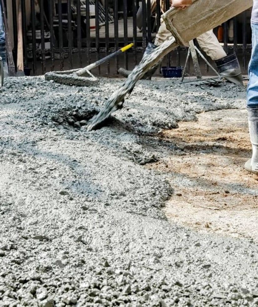 men pouring concrete